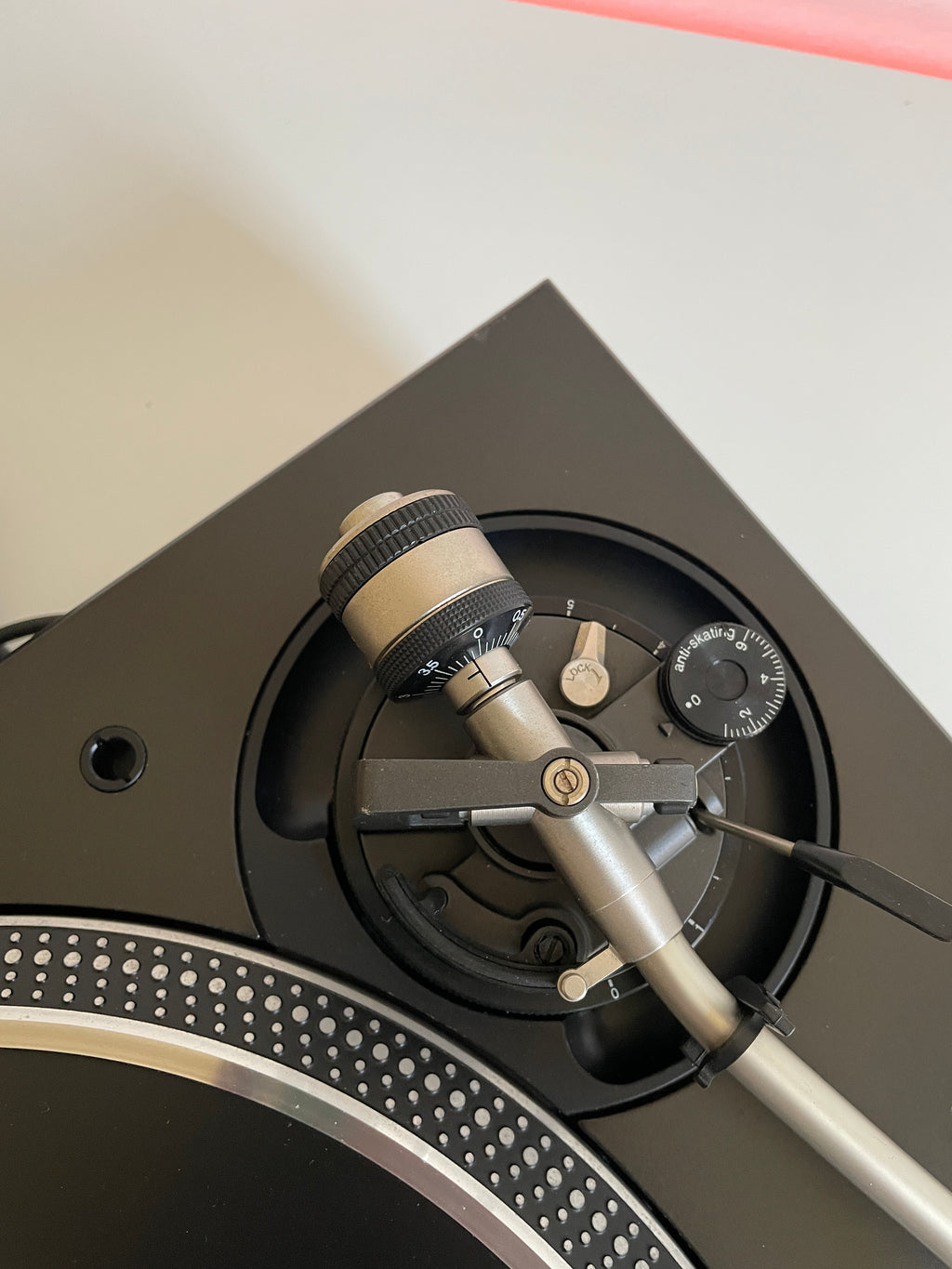 Close-up of a high-end watch mechanism on a light gray background