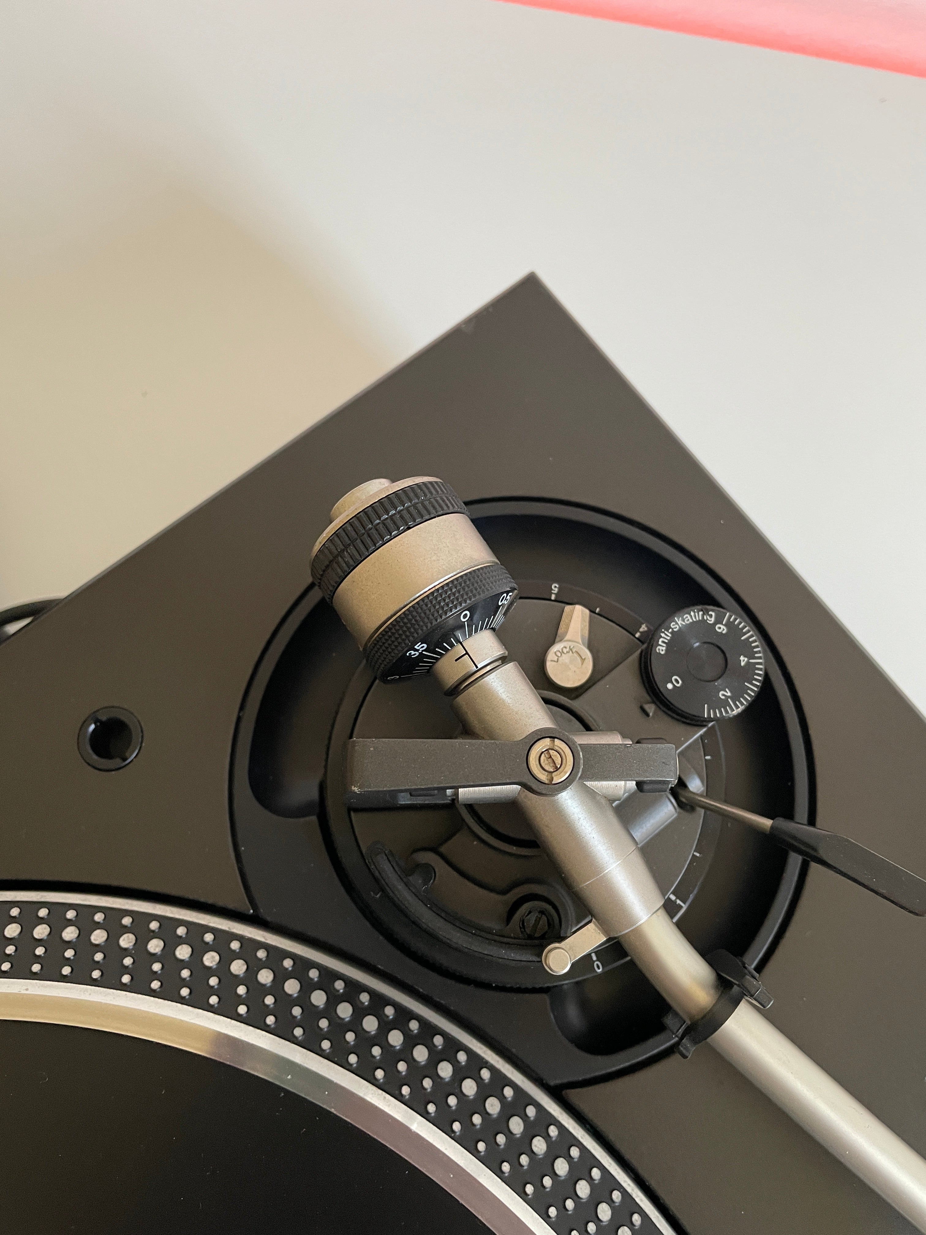 Close-up of a high-end watch mechanism on a light gray background
