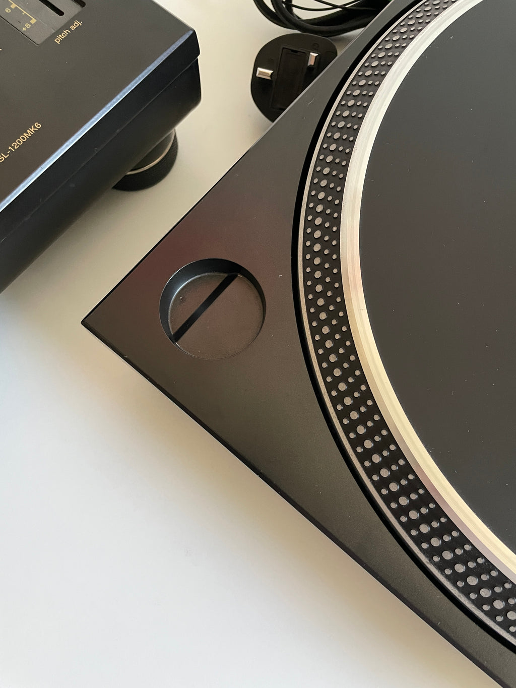 Close-up of a turntable platter with a blurred background