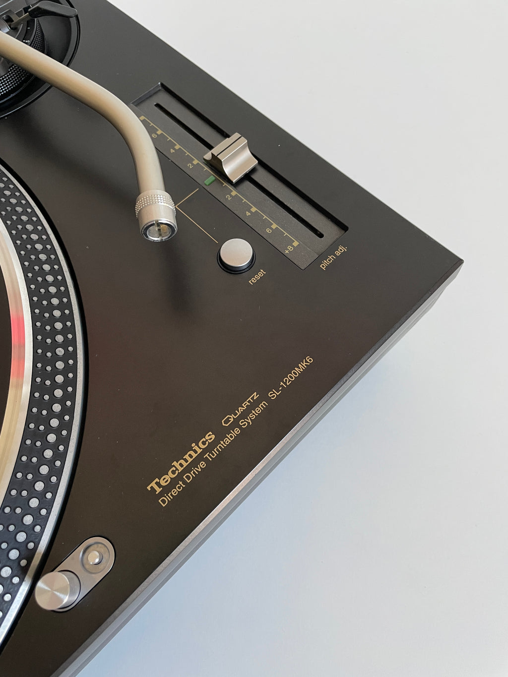 Close-up of a turntable with a white background