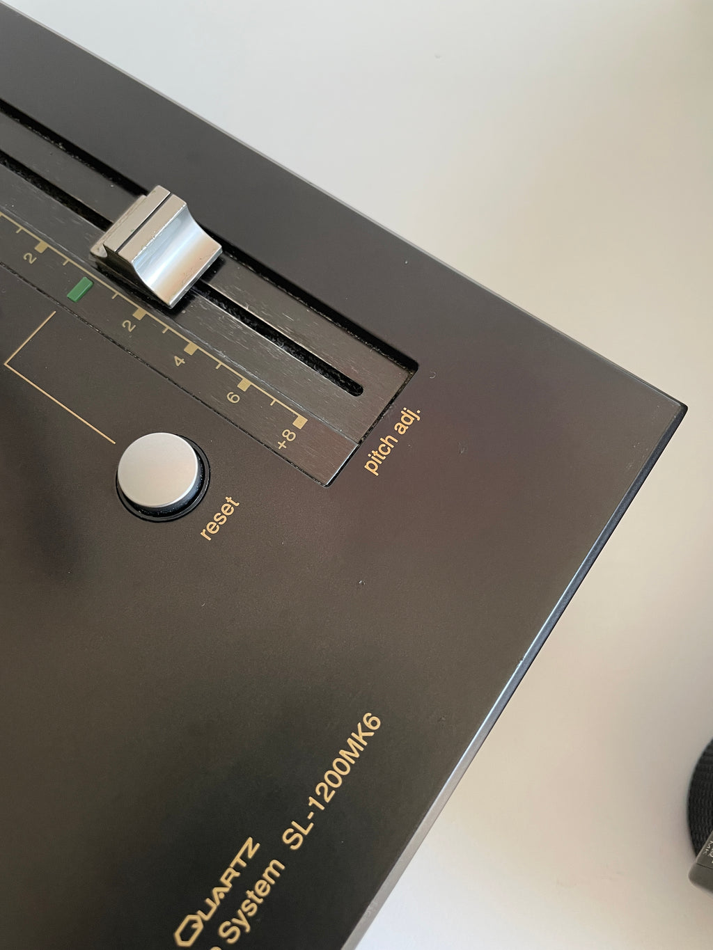 Close-up of a vintage equalizer with brand name on a white background