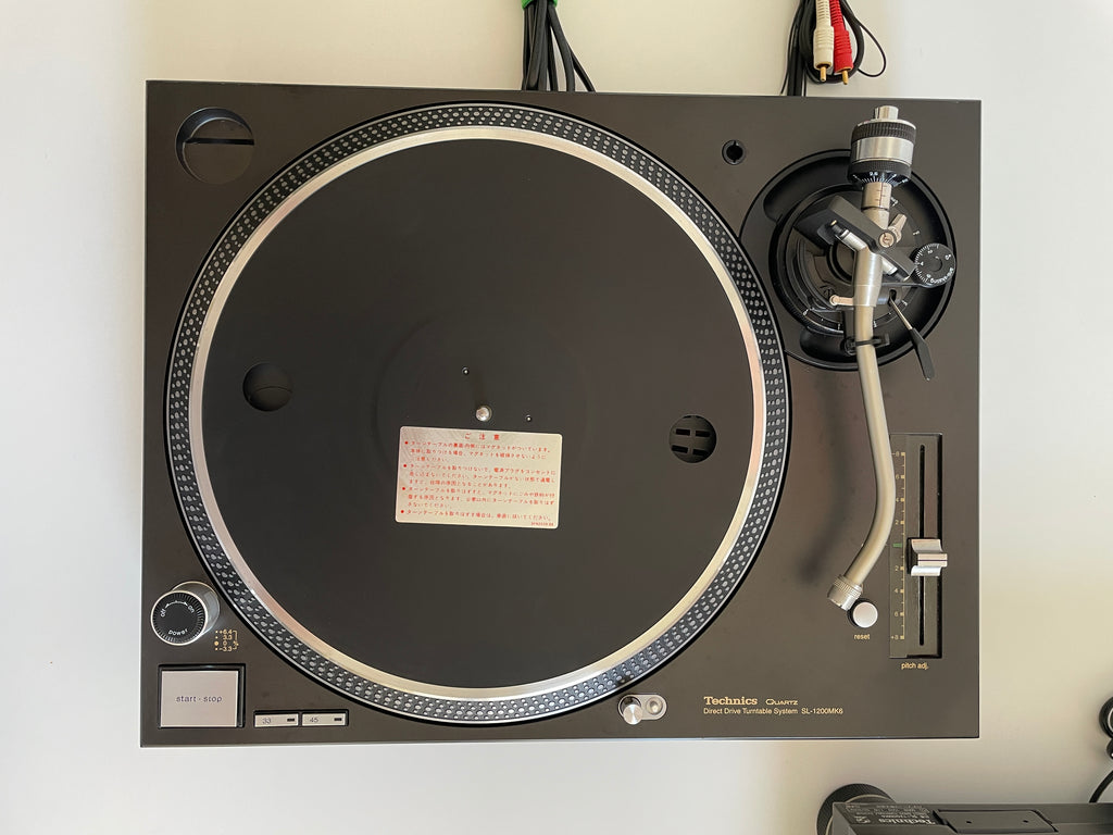 Turntable with a record on a white background