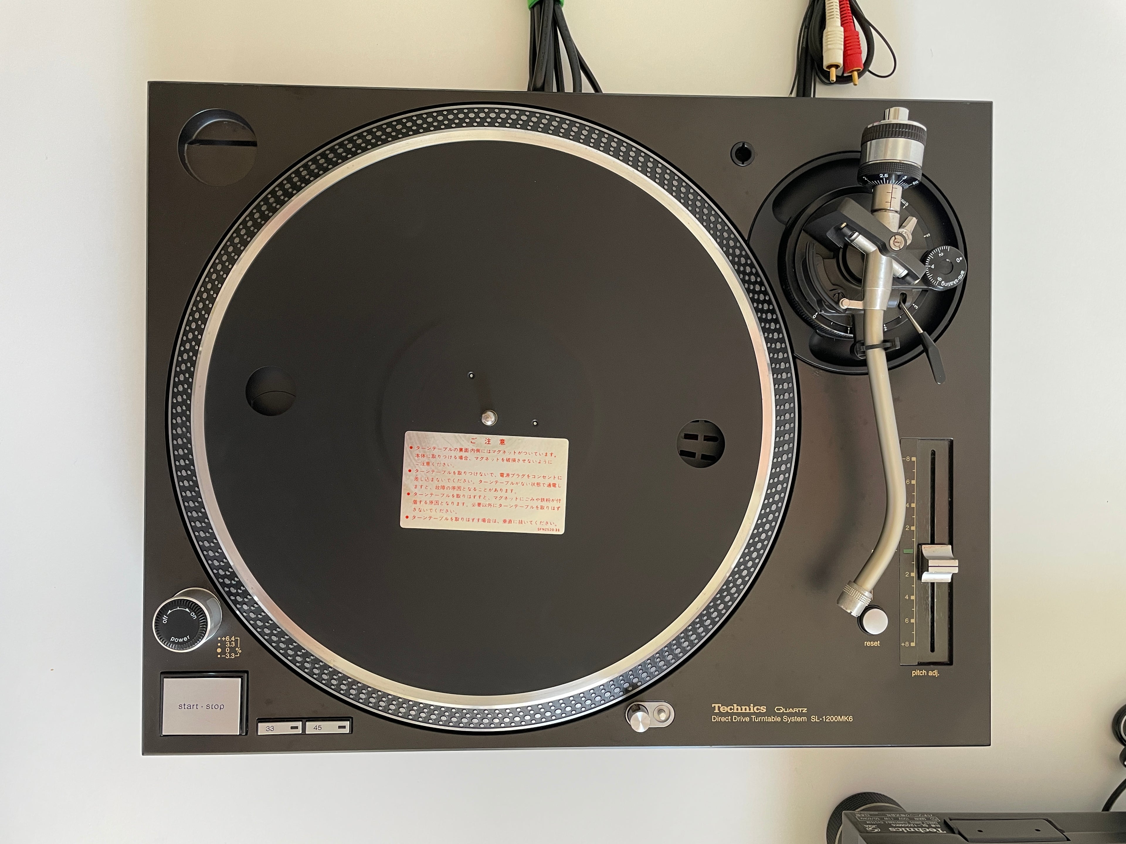 Turntable with a record on a white background