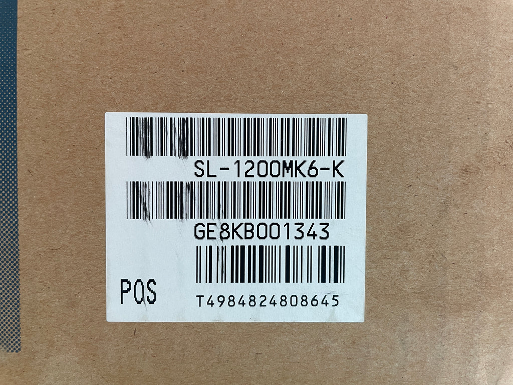 Barcode label on a brown cardboard surface