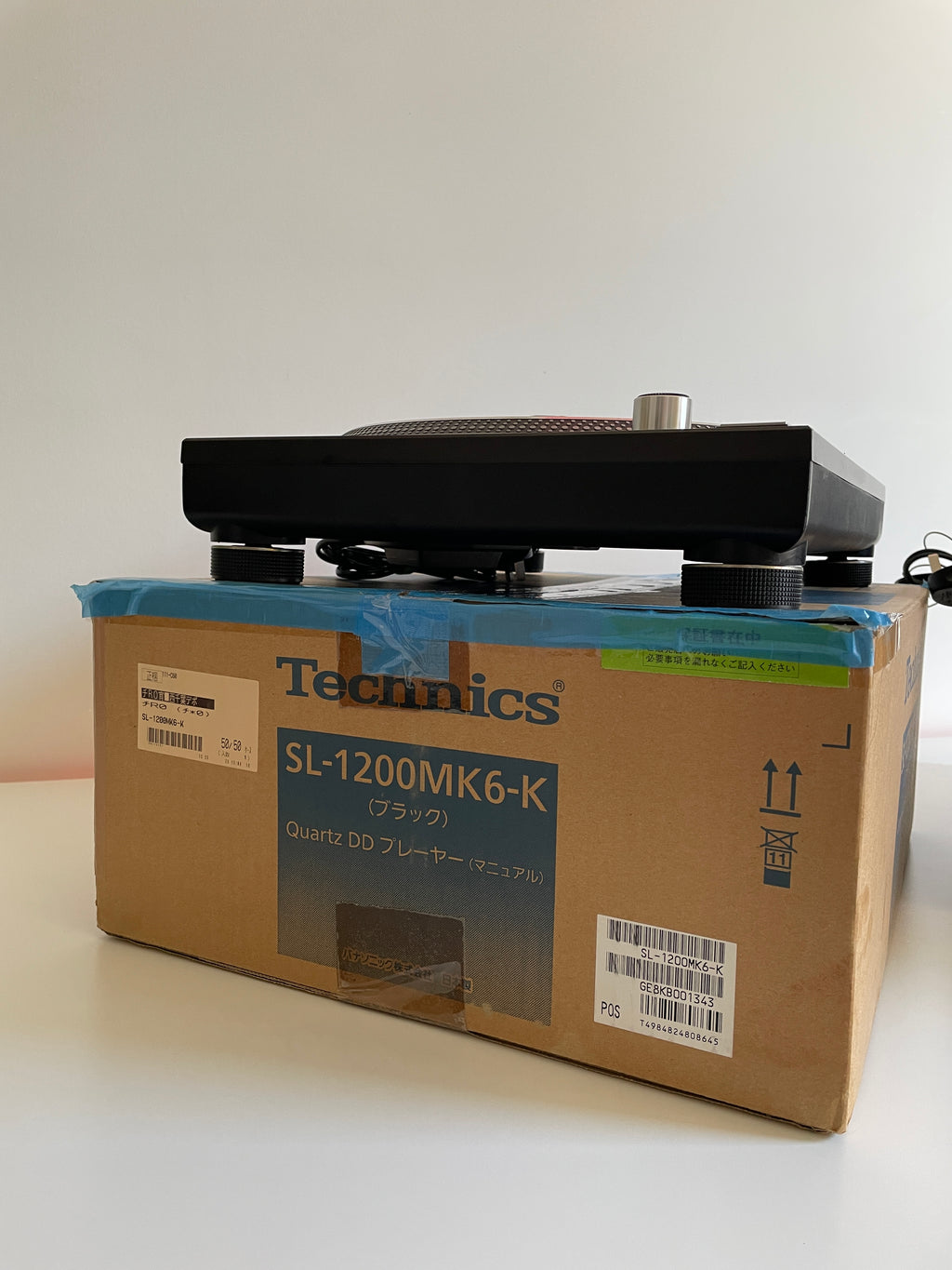 Cardboard box with Technics branding on a white background