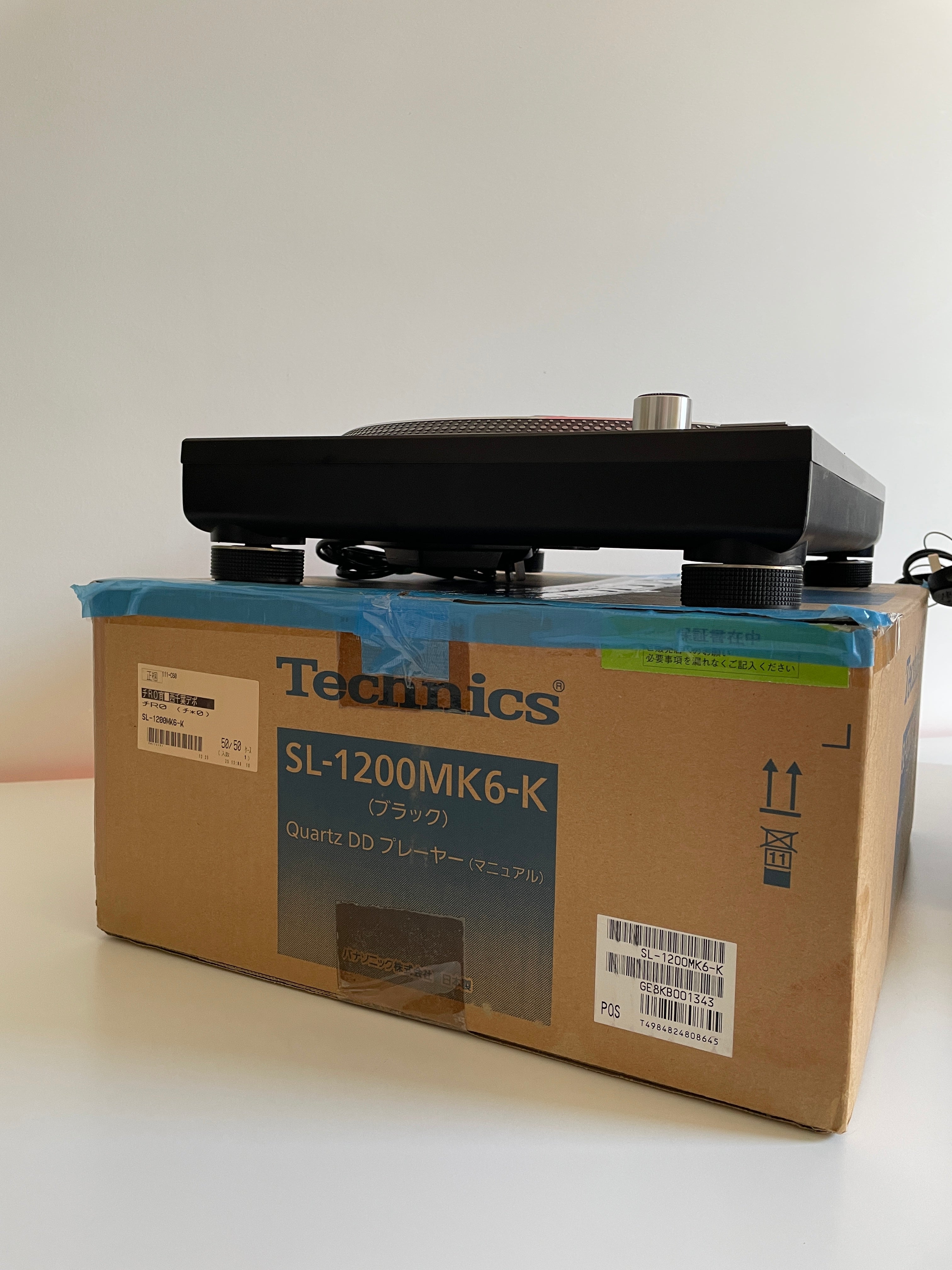 Cardboard box with Technics branding on a white background