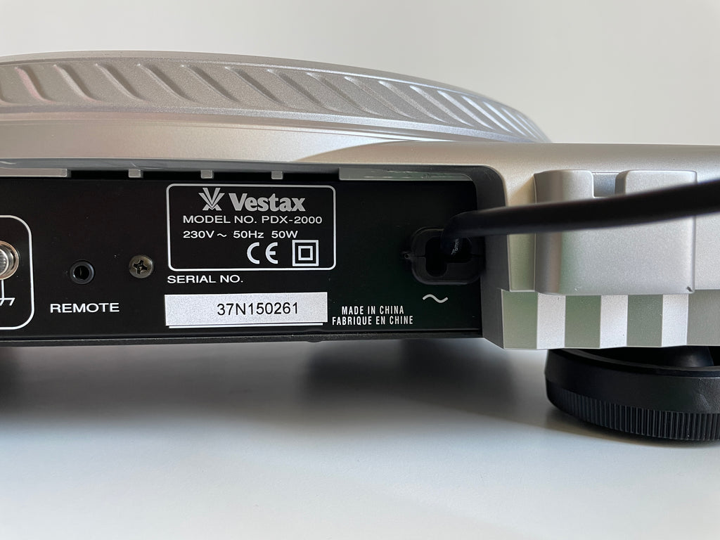 Back view of a Vestax PDX-2000 turntable with visible branding and model information.
