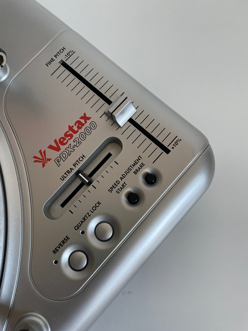 Close-up of a Vestax PDX2000 turntable equalizer on a white background