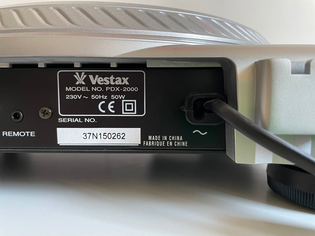 Back of a Vestax PDX-2000 turntable with branding and specifications.