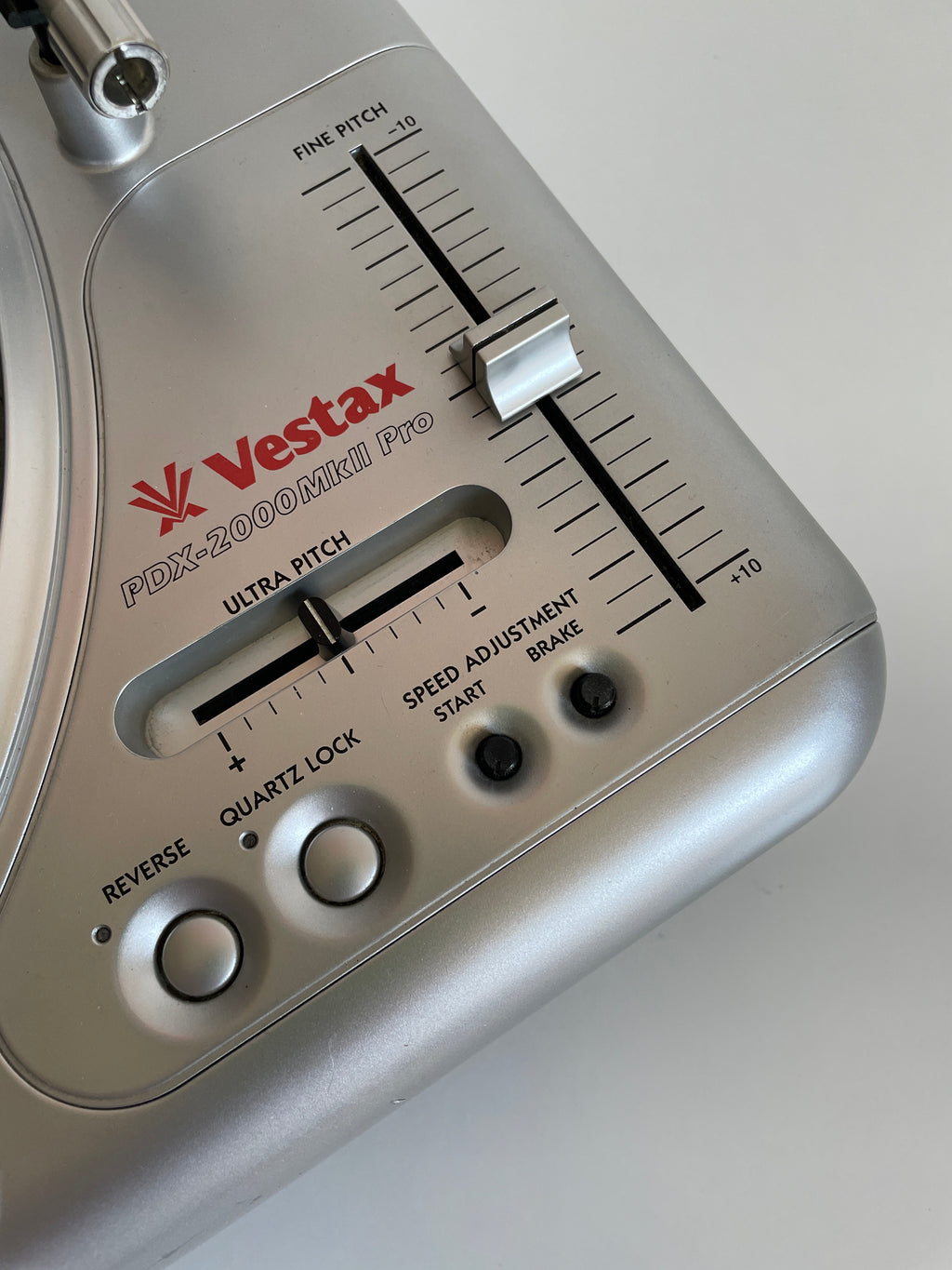 Close-up of a Vestax turntable equalizer on a white background