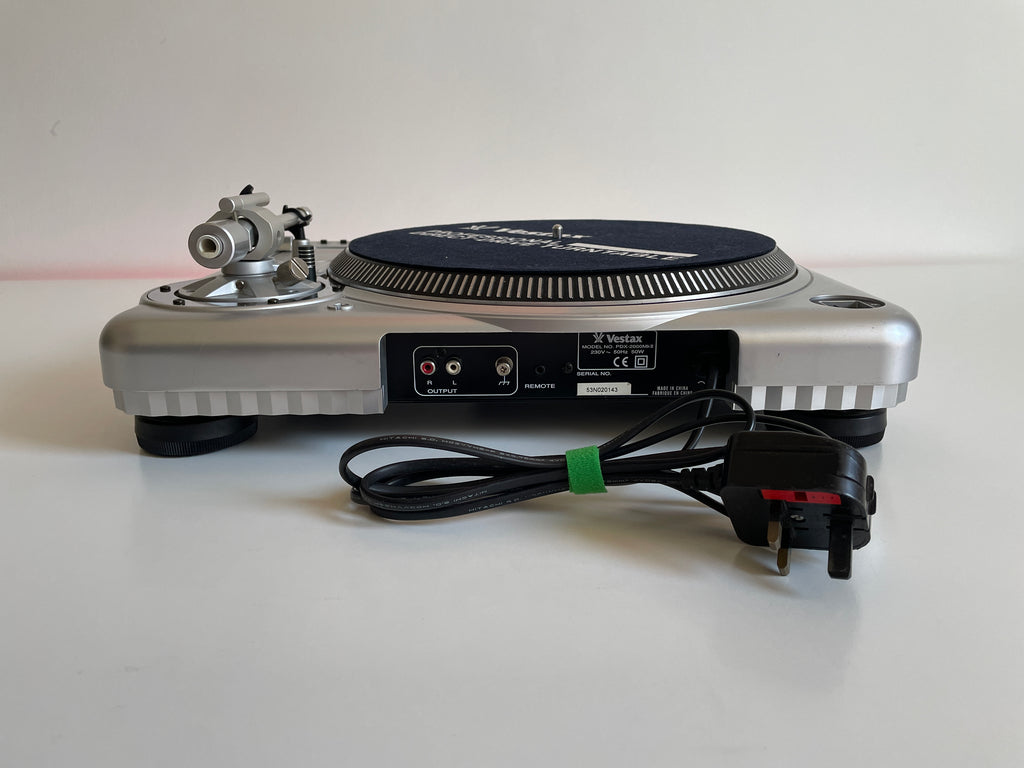 Turntable with power cord on a white background