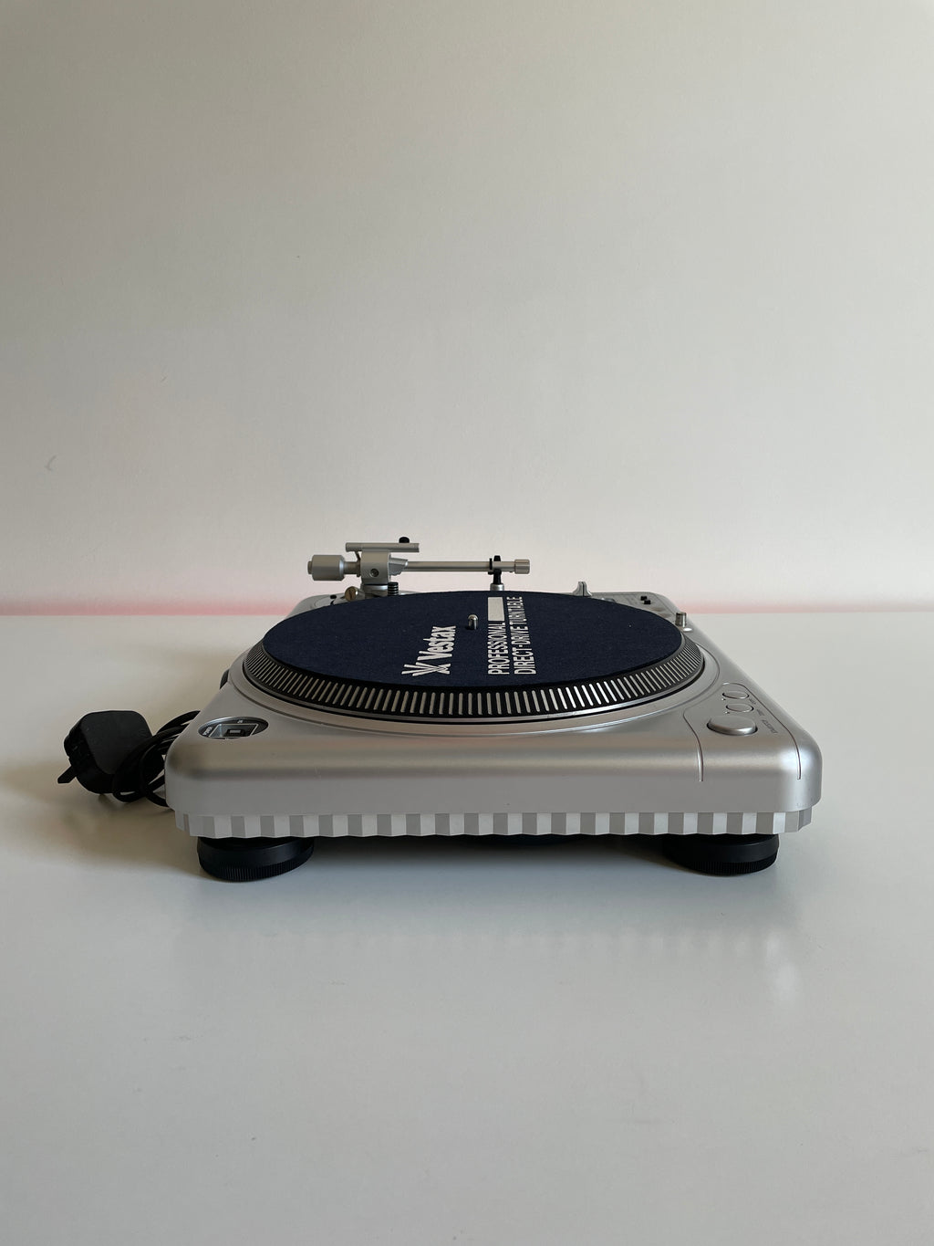 Small electronic device attached to a white wall