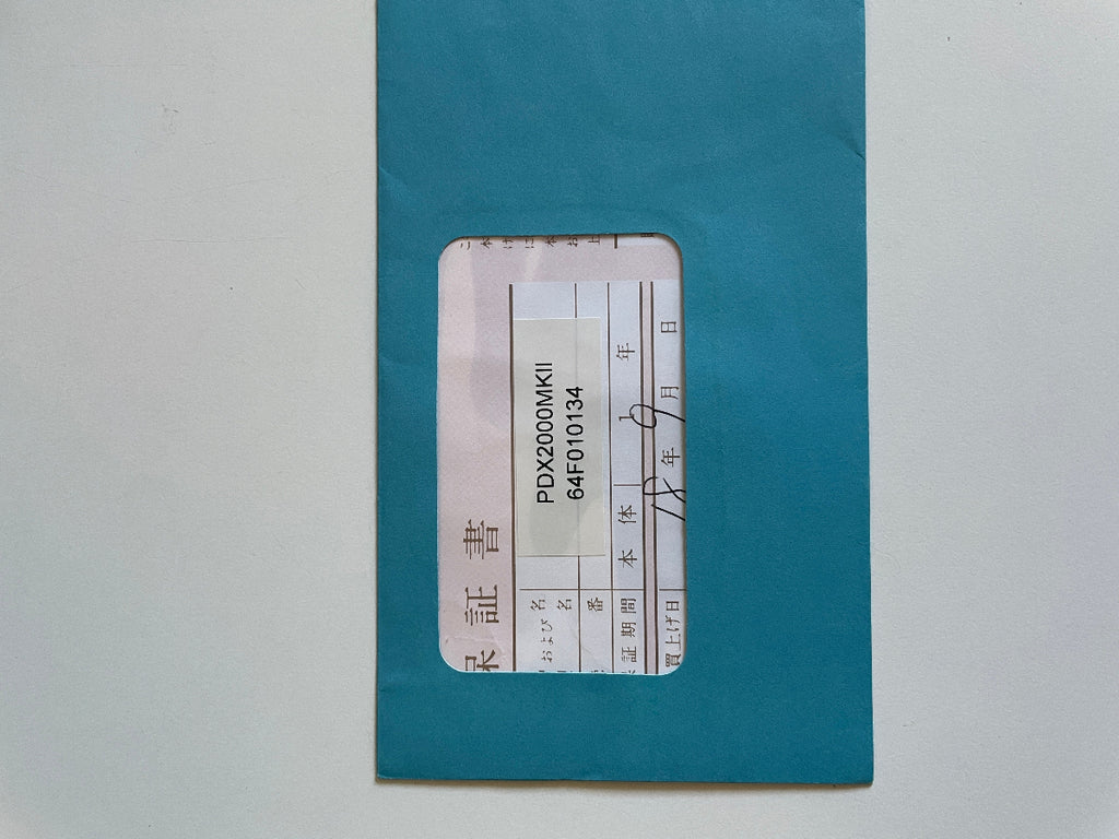 sales document of PDX2000MKII in blue envelope on white background